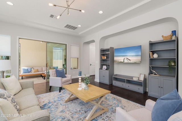 186 Citrus Ridge Dr, Ponte Vedra, FL 32081 - living area featuring arched walkways, dark wood finished floors, recessed lighting, and a chandelier