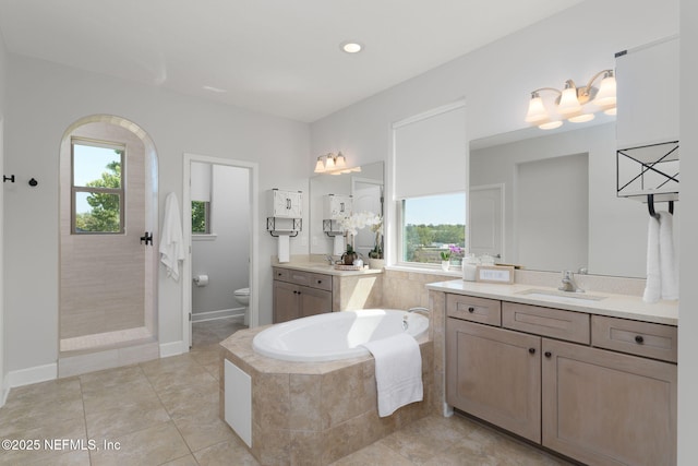 186 Citrus Ridge Dr, Ponte Vedra, FL 32081 - bathroom featuring plenty of natural light, a garden tub, two vanities, and tile patterned floors