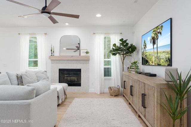 448 Willow Winds Pkwy, Saint Johns, FL 32259 - living room featuring ceiling fan, a tiled fireplace, recessed lighting, and light wood-style floors