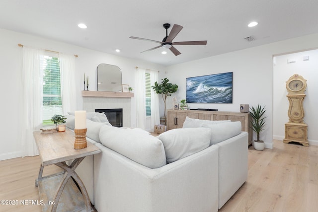 448 Willow Winds Pkwy, Saint Johns, FL 32259 - living room featuring light wood-style flooring, recessed lighting, a ceiling fan, and a glass covered fireplace