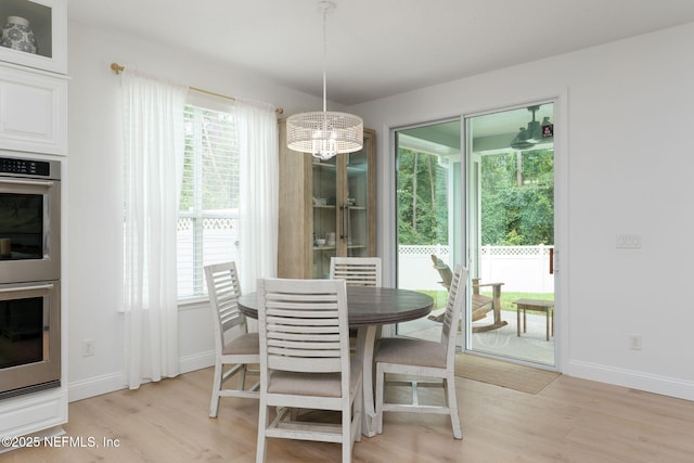 448 Willow Winds Pkwy, Saint Johns, FL 32259 - dining area featuring light wood finished floors, plenty of natural light, and a chandelier