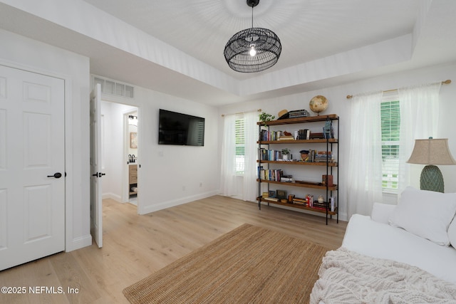 448 Willow Winds Pkwy, Saint Johns, FL 32259 - living room with light wood-style flooring and a raised ceiling