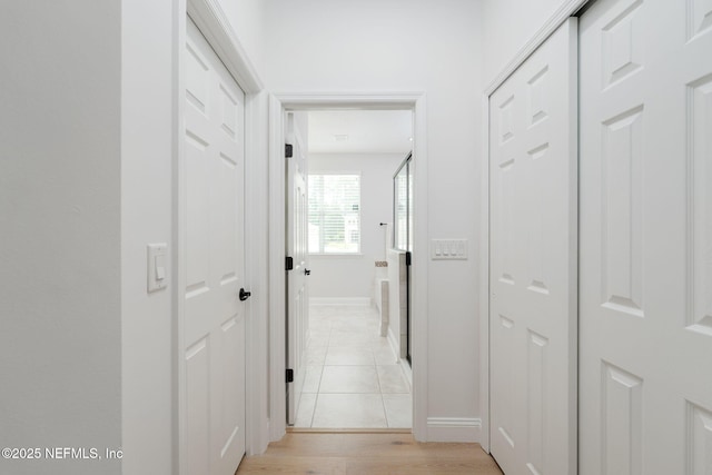 448 Willow Winds Pkwy, Saint Johns, FL 32259 - corridor with baseboards and light wood-type flooring