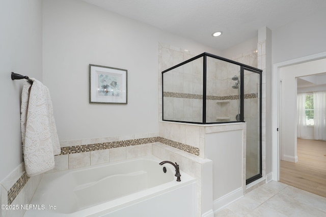 448 Willow Winds Pkwy, Saint Johns, FL 32259 - bathroom featuring a bath, a stall shower, and recessed lighting