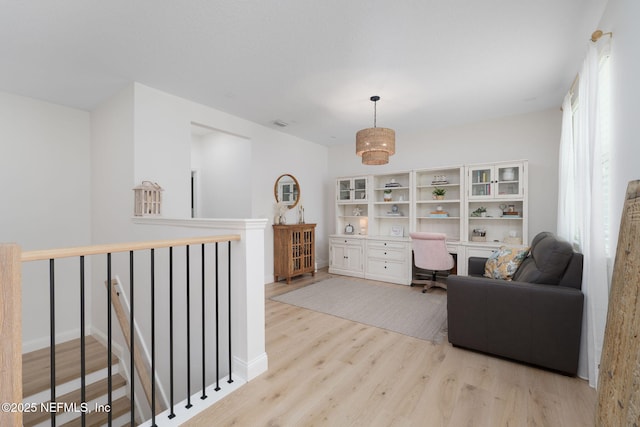 448 Willow Winds Pkwy, Saint Johns, FL 32259 - sitting room with an upstairs landing, wood finished floors, and built in study area