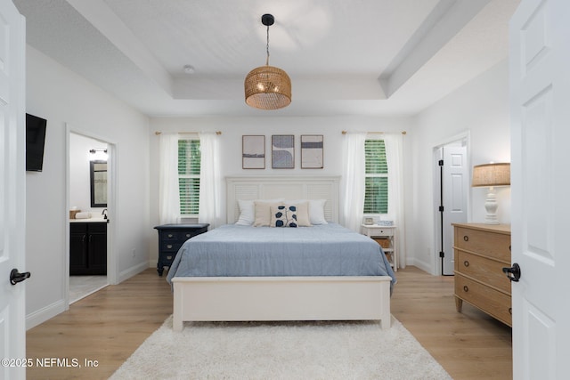 448 Willow Winds Pkwy, Saint Johns, FL 32259 - bedroom with a tray ceiling, light wood-type flooring, and multiple windows