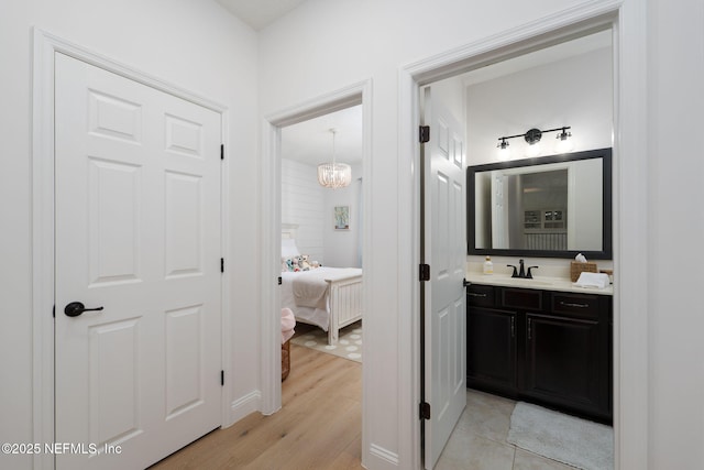 448 Willow Winds Pkwy, Saint Johns, FL 32259 - bathroom with vanity, a chandelier, wood finished floors, and ensuite bathroom