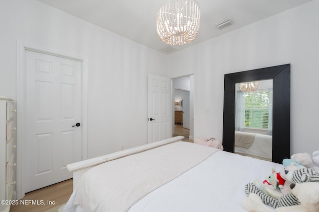 448 Willow Winds Pkwy, Saint Johns, FL 32259 - bedroom featuring a chandelier and light wood finished floors