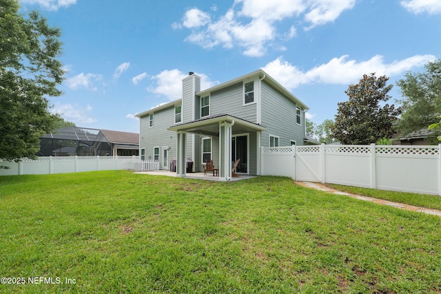 448 Willow Winds Pkwy, Saint Johns, FL 32259 - back of house featuring a patio, a chimney, and a fenced backyard