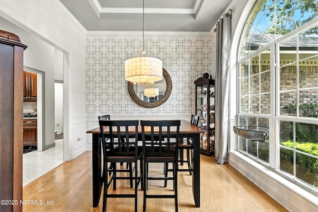 12921 Jupiter Hills Cir N, Jacksonville, FL 32225 - dining room featuring plenty of natural light, a chandelier, light wood-style floors, and ornamental molding