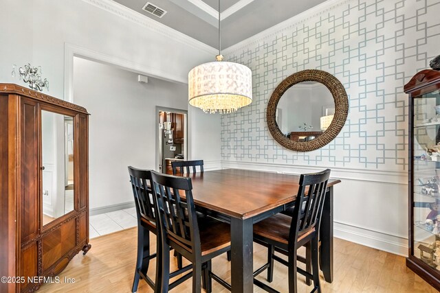 12921 Jupiter Hills Cir N, Jacksonville, FL 32225 - dining room featuring crown molding and light wood-style flooring