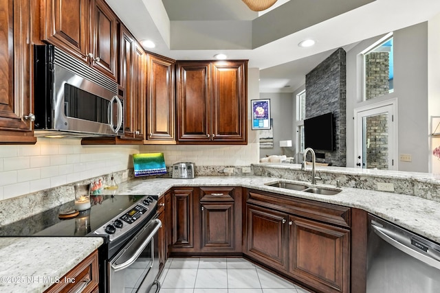 12921 Jupiter Hills Cir N, Jacksonville, FL 32225 - kitchen featuring stainless steel appliances, tasteful backsplash, light stone counters, recessed lighting, and a ceiling fan