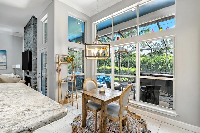 12921 Jupiter Hills Cir N, Jacksonville, FL 32225 - tiled dining area featuring crown molding and a towering ceiling