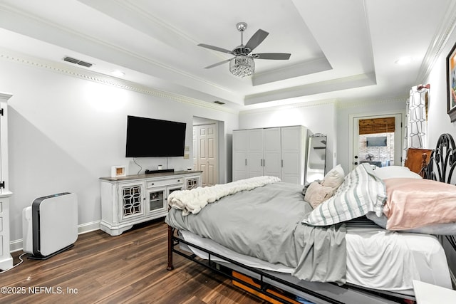 12921 Jupiter Hills Cir N, Jacksonville, FL 32225 - bedroom with a raised ceiling, dark wood-style flooring, crown molding, a ceiling fan, and recessed lighting