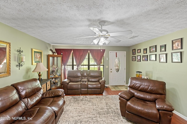4422 SE 2nd Ave, Keystone Heights, FL 32656 - living room featuring ceiling fan, wood finished floors, and a textured ceiling