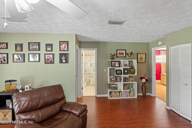 4422 SE 2nd Ave, Keystone Heights, FL 32656 - living room with a textured ceiling and wood finished floors