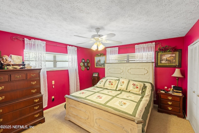 4422 SE 2nd Ave, Keystone Heights, FL 32656 - bedroom featuring light carpet, a textured ceiling, and ceiling fan