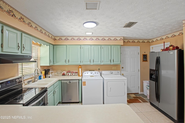 4422 SE 2nd Ave, Keystone Heights, FL 32656 - laundry room featuring separate washer and dryer, a textured ceiling, and light tile patterned floors