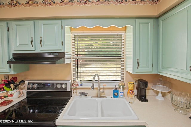 4422 SE 2nd Ave, Keystone Heights, FL 32656 - kitchen with electric range, under cabinet range hood, light countertops, and plenty of natural light