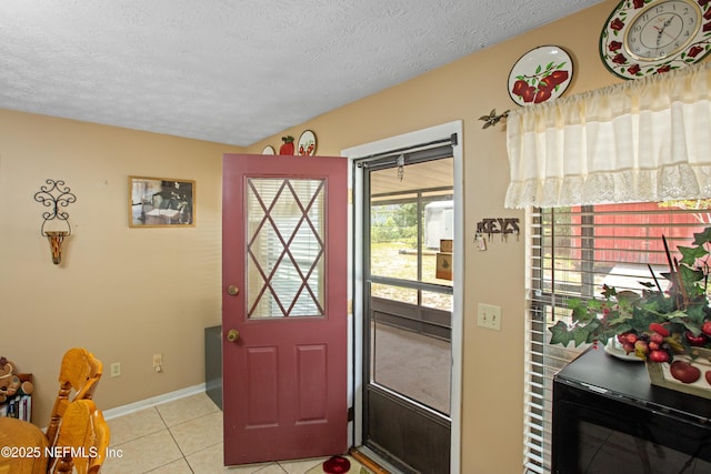 4422 SE 2nd Ave, Keystone Heights, FL 32656 - foyer entrance with light tile patterned flooring and a textured ceiling