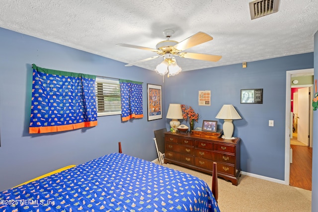 4422 SE 2nd Ave, Keystone Heights, FL 32656 - bedroom featuring a textured ceiling, a ceiling fan, and carpet flooring