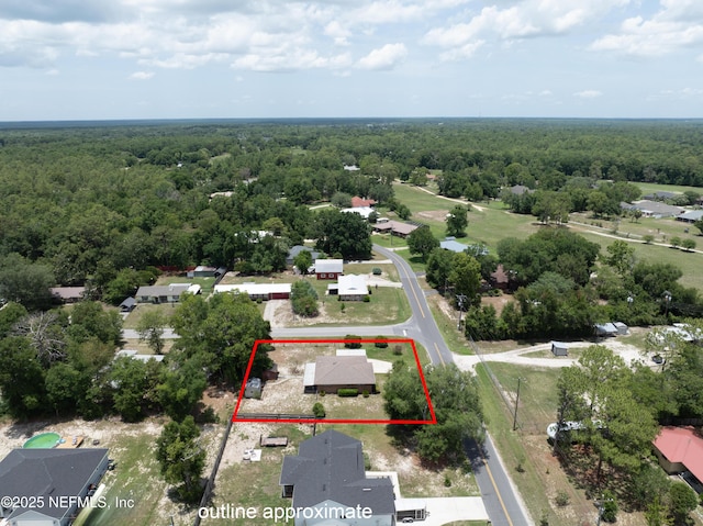 4422 SE 2nd Ave, Keystone Heights, FL 32656 - aerial perspective of suburban area featuring a forest and property parcel outlined