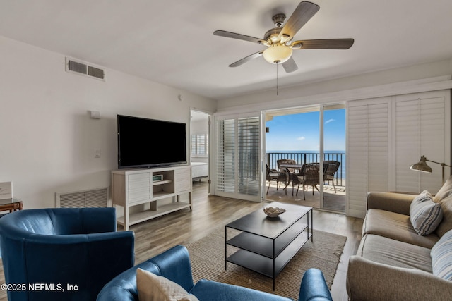 3350 Fletcher Ave Unit 6J, Fernandina Beach, FL 32034 - living room with ceiling fan and wood finished floors