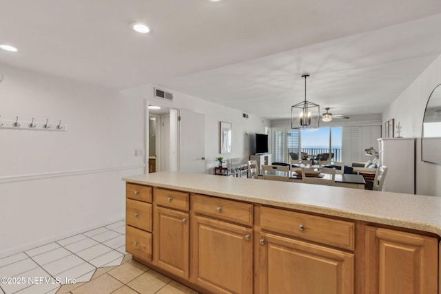 3350 Fletcher Ave Unit 6J, Fernandina Beach, FL 32034 - kitchen with light countertops, open floor plan, light tile patterned floors, pendant lighting, and recessed lighting