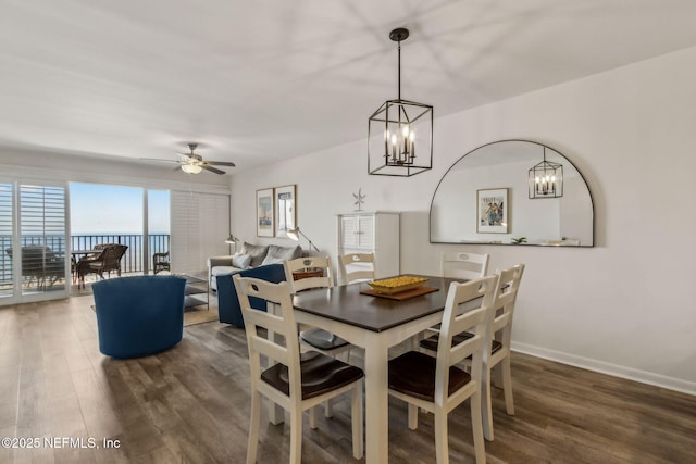 3350 Fletcher Ave Unit 6J, Fernandina Beach, FL 32034 - dining space featuring wood finished floors, a chandelier, and a ceiling fan