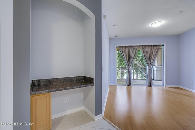 8601 Beach Blvd Unit 1008, Jacksonville, FL 32216 - interior space with light wood-style flooring and arched walkways