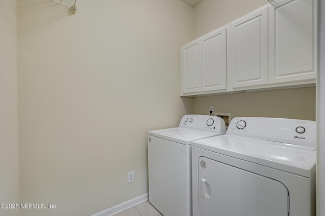8601 Beach Blvd Unit 1008, Jacksonville, FL 32216 - washroom with independent washer and dryer, cabinet space, and light tile patterned floors