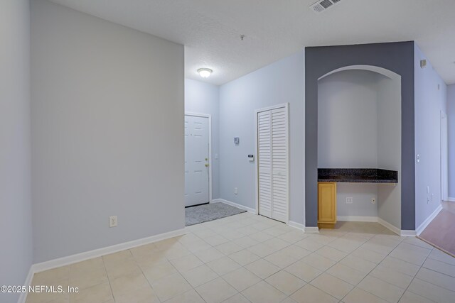 8601 Beach Blvd Unit 1008, Jacksonville, FL 32216 - empty room with light tile patterned floors