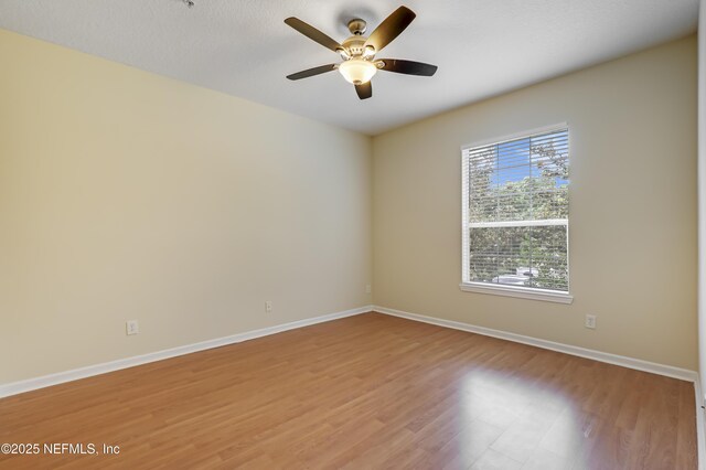 8601 Beach Blvd Unit 1008, Jacksonville, FL 32216 - empty room with light wood-style flooring and a ceiling fan