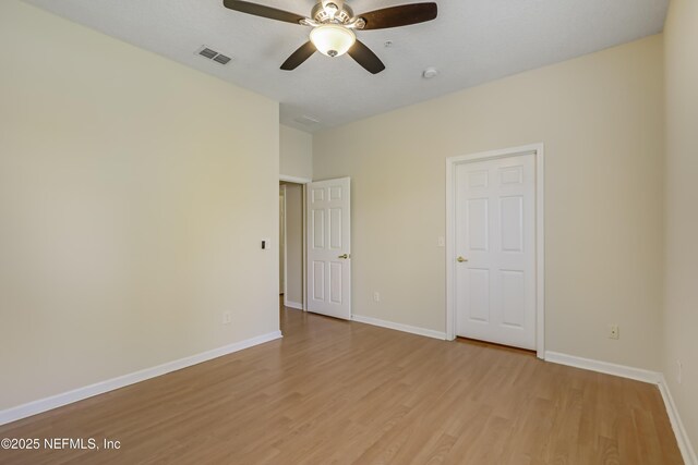 8601 Beach Blvd Unit 1008, Jacksonville, FL 32216 - unfurnished room with light wood finished floors and ceiling fan