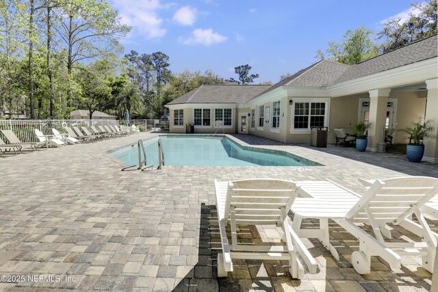 8601 Beach Blvd Unit 1008, Jacksonville, FL 32216 - community pool featuring a patio area