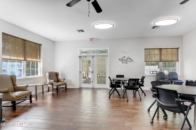 8601 Beach Blvd Unit 1008, Jacksonville, FL 32216 - dining room with healthy amount of natural light, ceiling fan, dark wood finished floors, and french doors