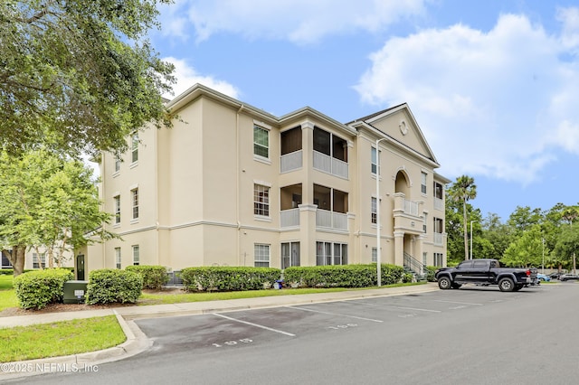 8601 Beach Blvd Unit 1008, Jacksonville, FL 32216 - view of building exterior with uncovered parking