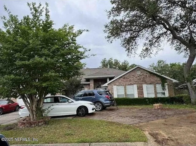 2811 Dunsmuir Dr, Navarre, FL 32566 - view of front facade with driveway and brick siding