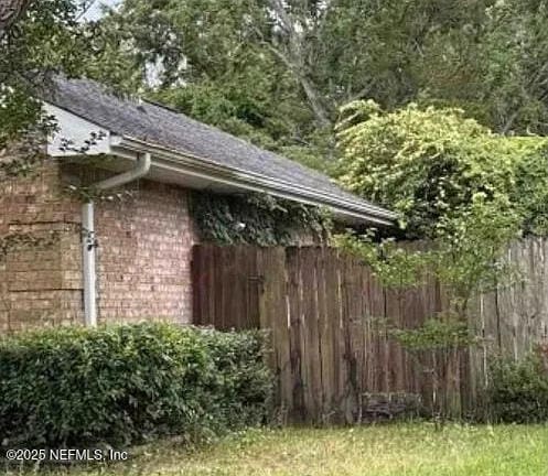 2811 Dunsmuir Dr, Navarre, FL 32566 - view of outbuilding featuring a forest view