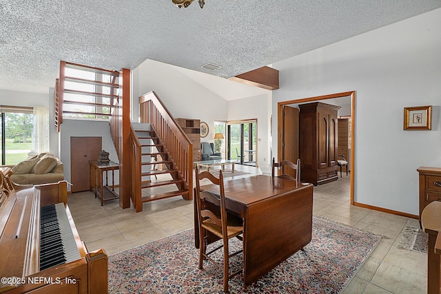 55 Village Cir, Palm Coast, FL 32164 - dining area with a textured ceiling, healthy amount of natural light, stairway, and baseboards