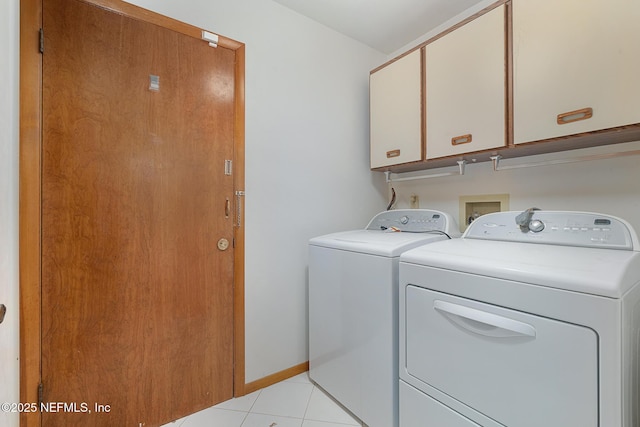 55 Village Cir, Palm Coast, FL 32164 - laundry room featuring cabinet space, independent washer and dryer, light tile patterned floors, and baseboards