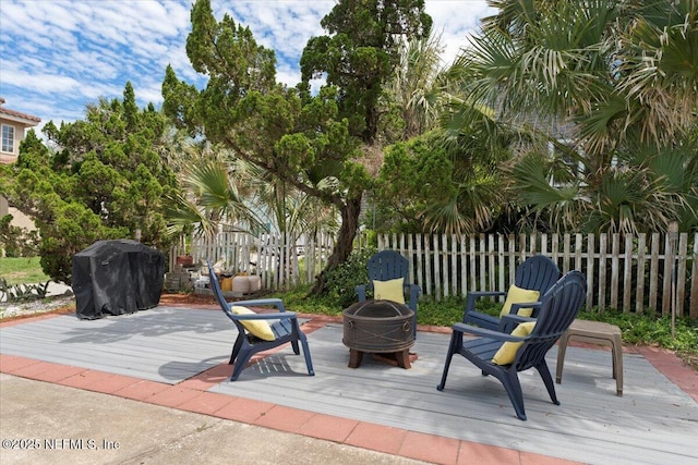 1506 Strand St, Neptune Beach, FL 32266 - view of patio with a wooden deck, area for grilling, and an outdoor fire pit