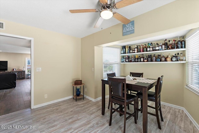 1506 Strand St, Neptune Beach, FL 32266 - dining room featuring wood finished floors and a ceiling fan