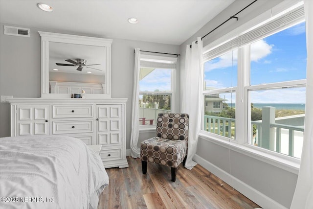 1506 Strand St, Neptune Beach, FL 32266 - bedroom featuring multiple windows, wood finished floors, and recessed lighting