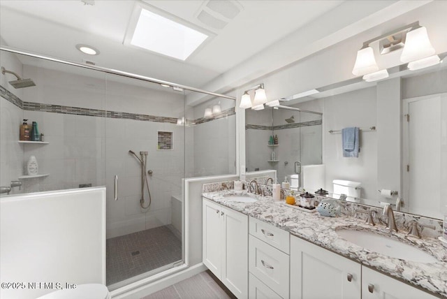 1506 Strand St, Neptune Beach, FL 32266 - bathroom with a stall shower, double vanity, and tile patterned flooring