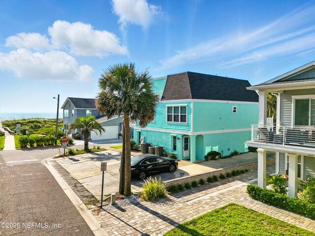 1506 Strand St, Neptune Beach, FL 32266 - back of property featuring roof with shingles