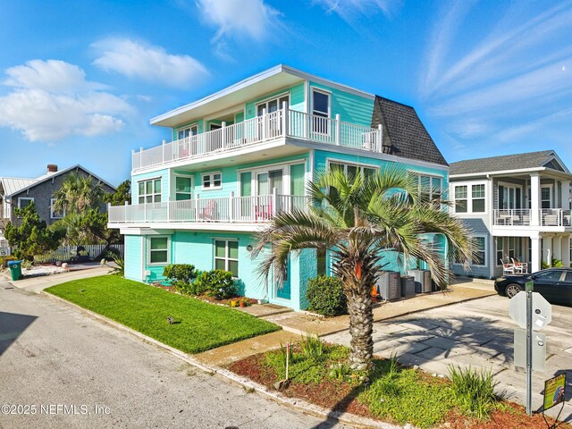 1506 Strand St, Neptune Beach, FL 32266 - view of front of house with a balcony