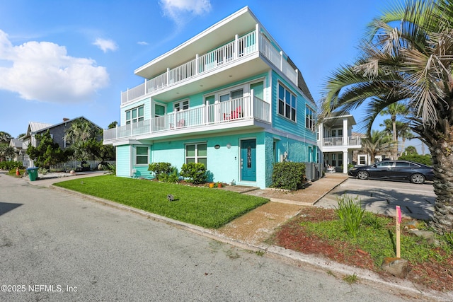 1506 Strand St, Neptune Beach, FL 32266 - view of front of house featuring a front yard and stucco siding