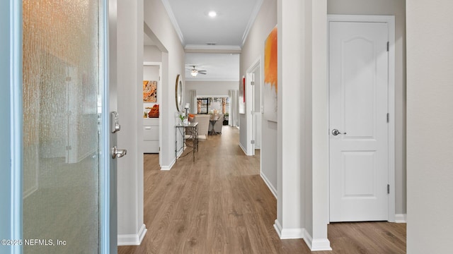 81 Green Cir, Palm Coast, FL 32164 - hall featuring wood finished floors, crown molding, baseboards, and recessed lighting