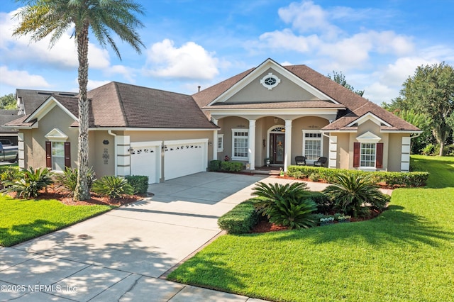 641 Donald Ross Way, Saint Augustine, FL 32092 - view of front of house with stucco siding, a garage, covered porch, a front lawn, and driveway